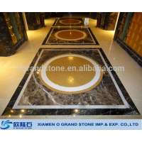 Water jet medallion in marble lobby floor Water jet medallion